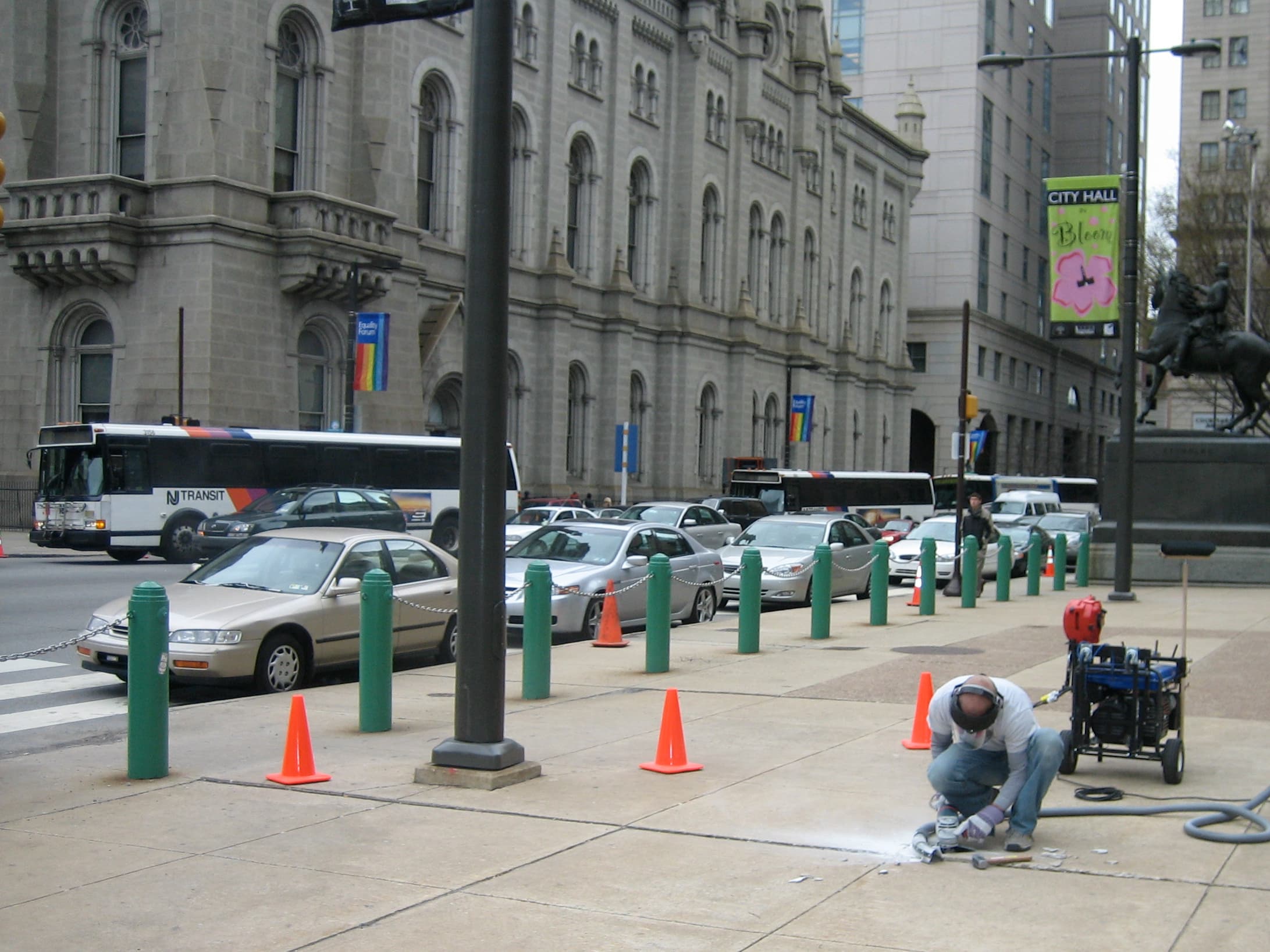 Technician using PCC patented slicing equipment to remove a sidewalk trip hazard